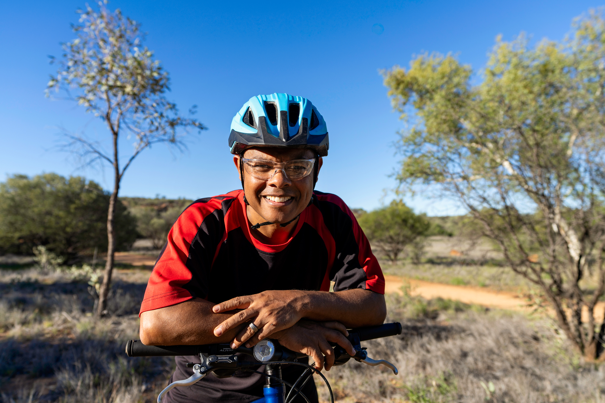 Smiling man on bicycle 