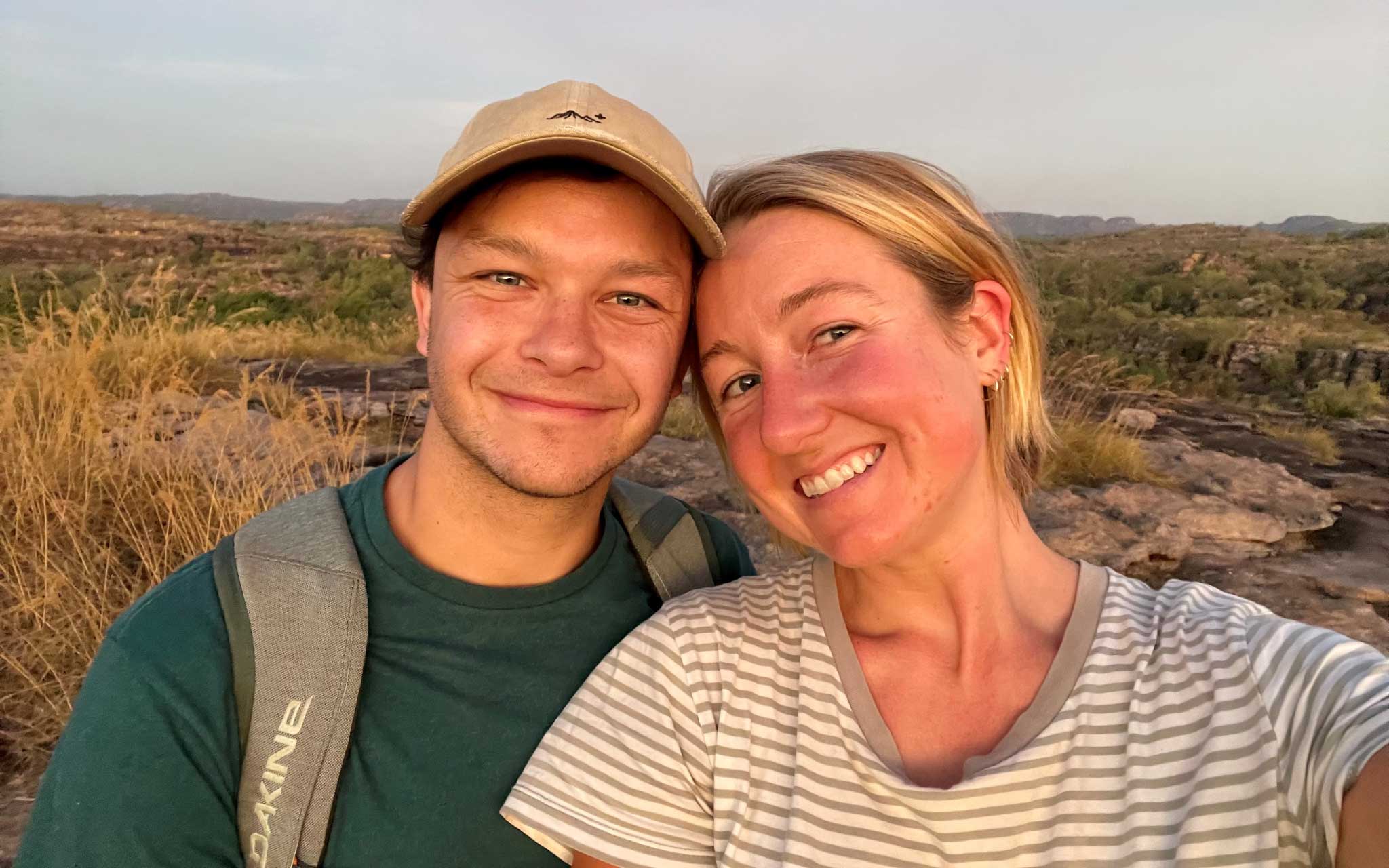 Maddy with partner in front of remote landscape