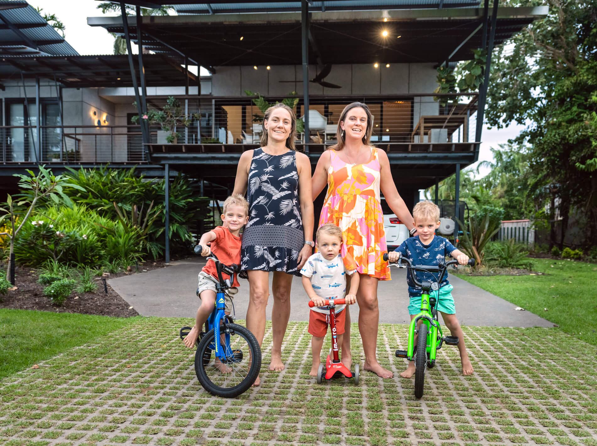 Couple with kids in front of their accomodation