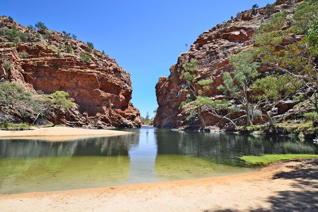 Ellery Creek Big Hole in the West MacDonnell National Park, a popular, permanent waterhole surrounded by towering red cliffs. 