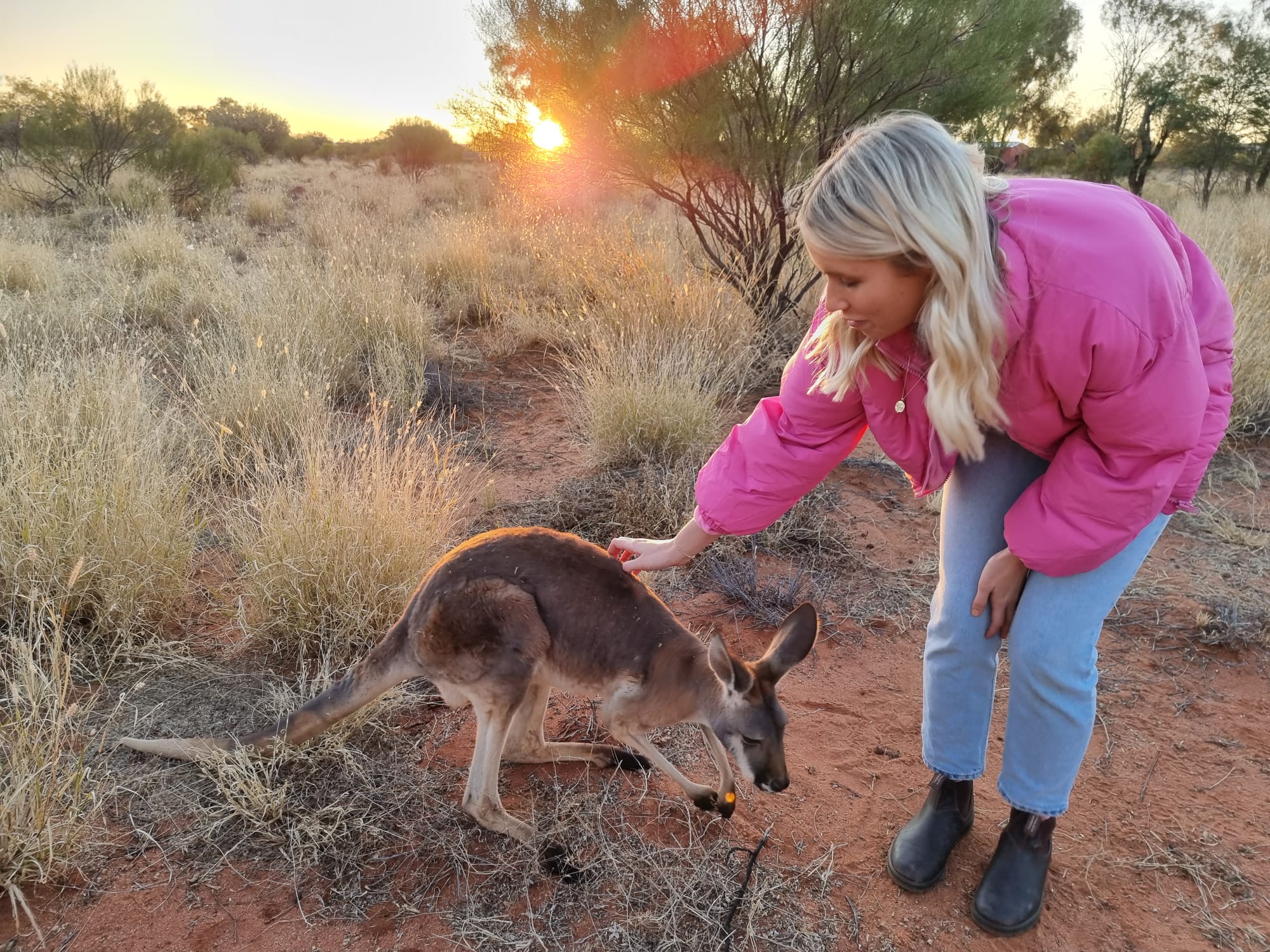 women petting kangaroo