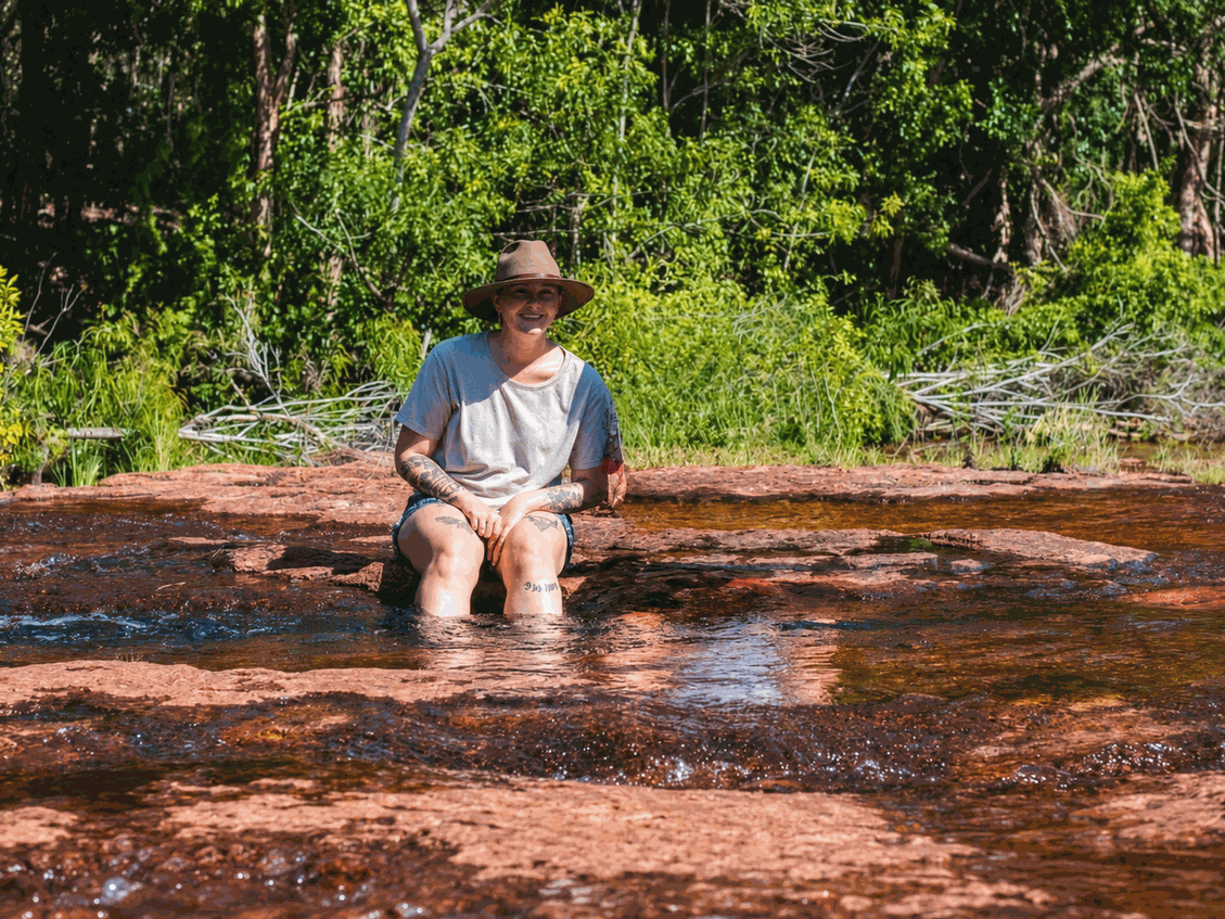 Person Sitting in Water Hole