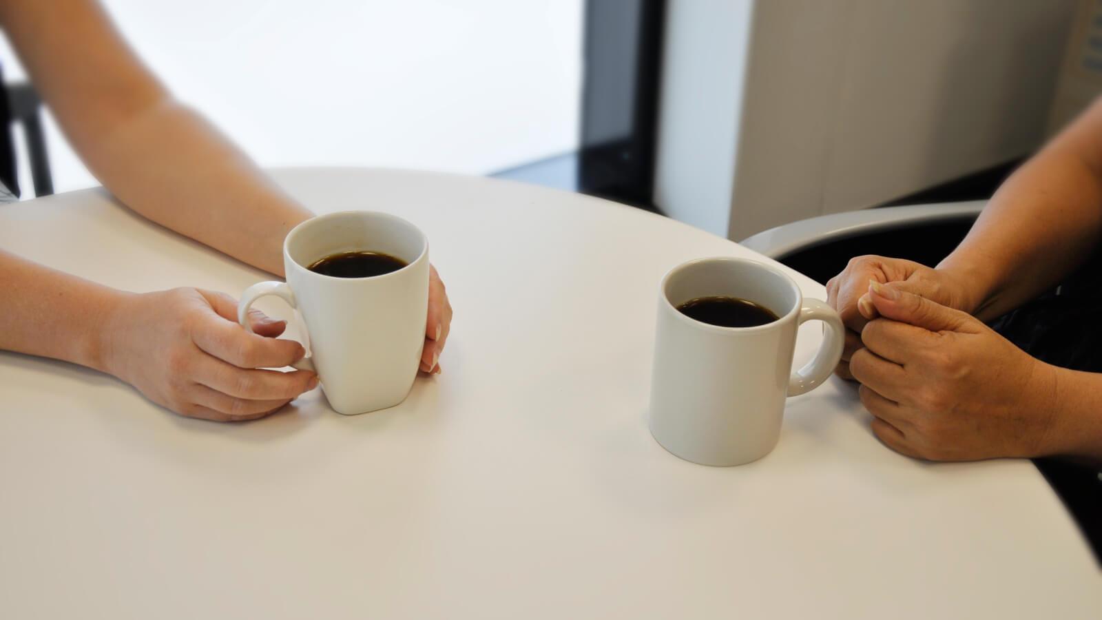 Two coffee cups on a table