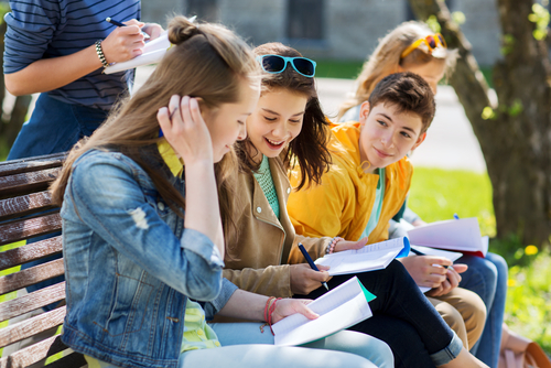 Students sitting on bench