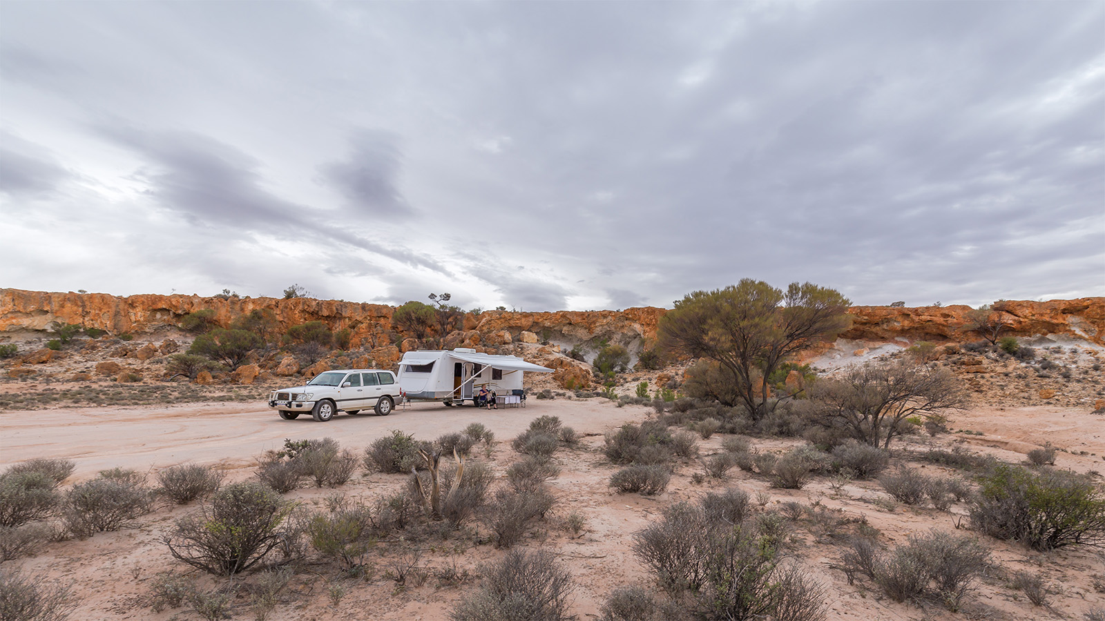 Car pulling caravan outback