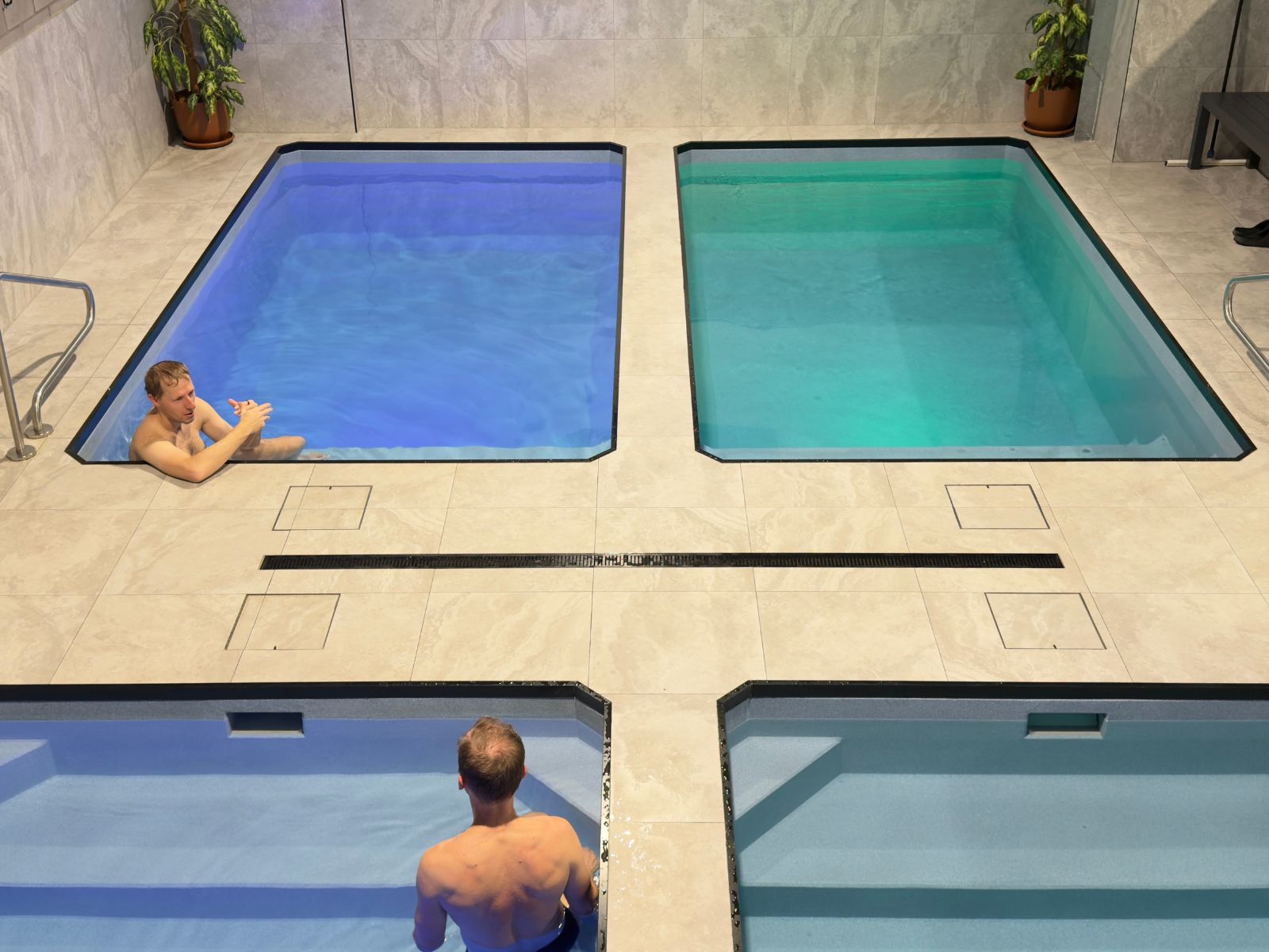 ndoor contrast therapy pools with two people in the water.