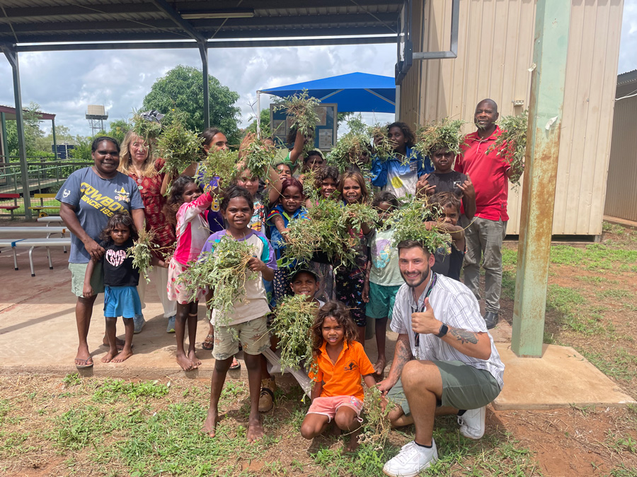 smiling teacher with students