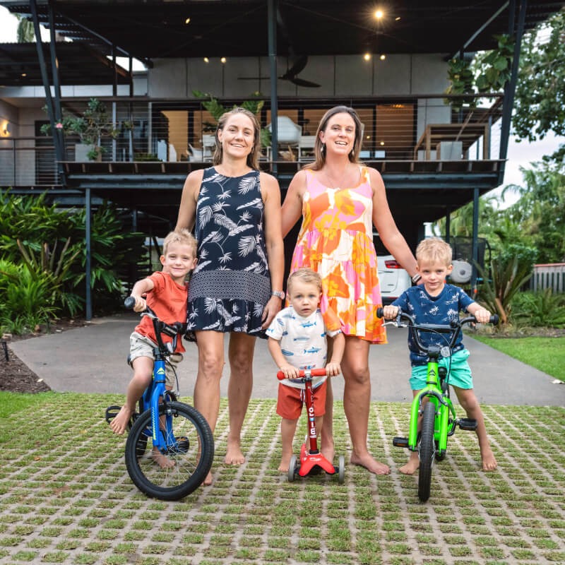 Family group photo in front of house