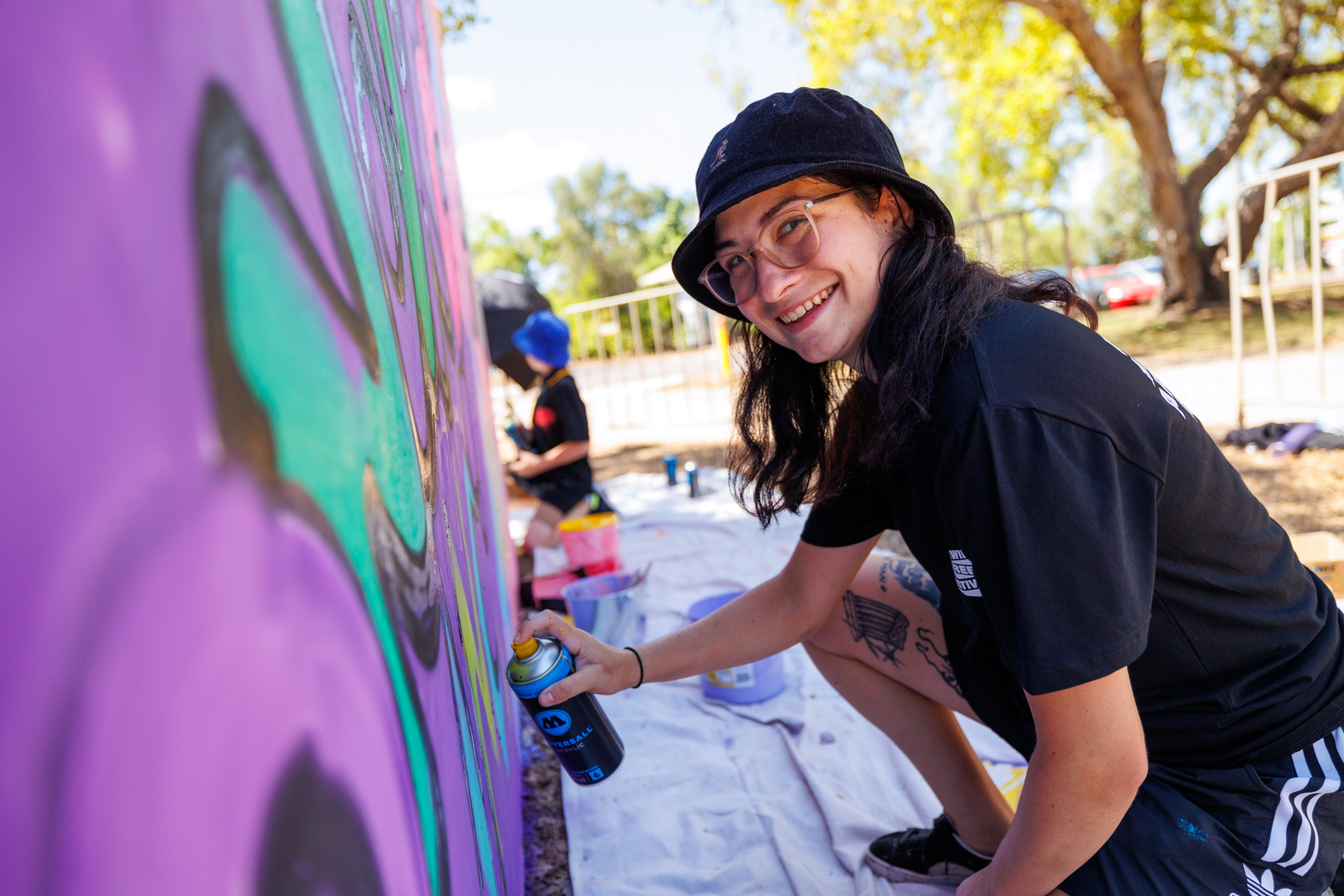 Darwin Street Art Festival NT - community volunteer painting mural 