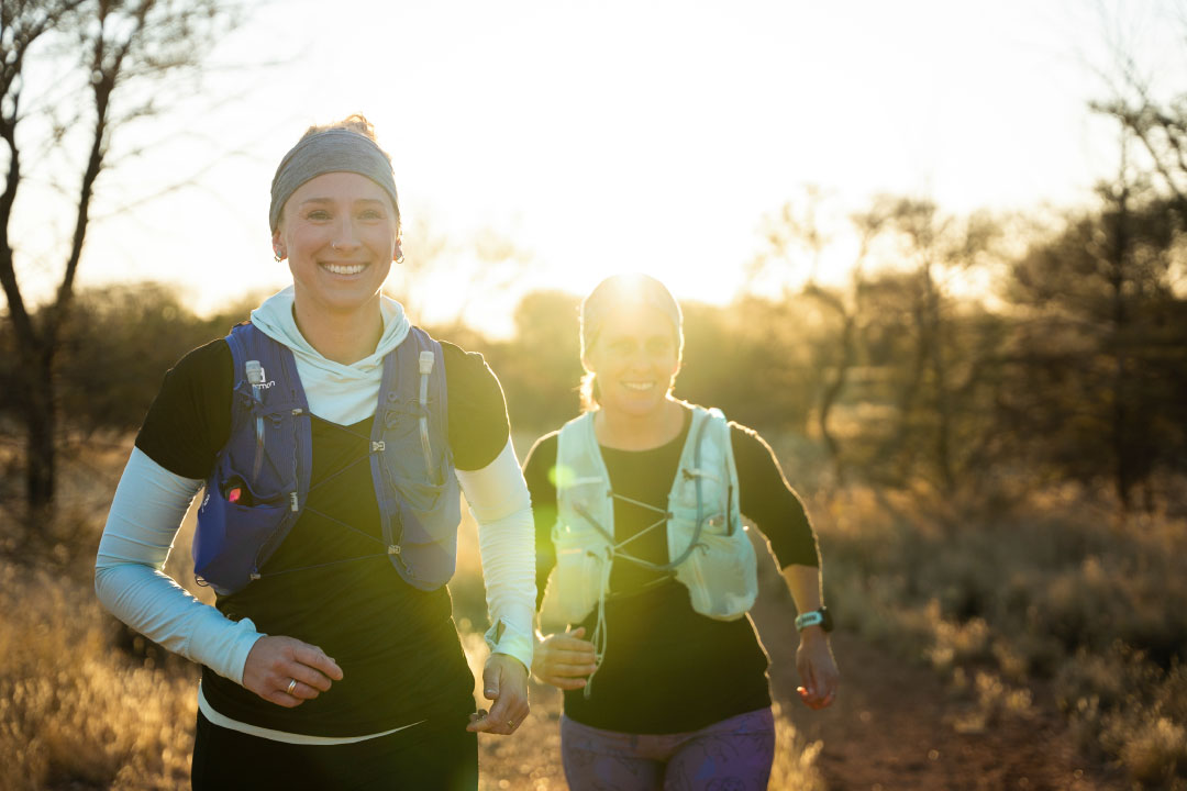 two women trail running during sunset in Alice Springs Northern Territory