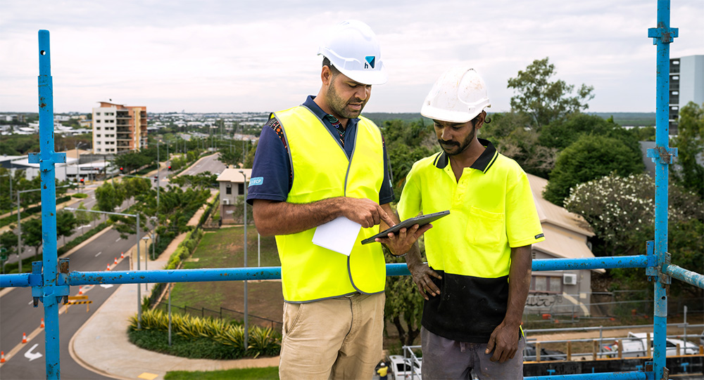 Construction worker on site banner